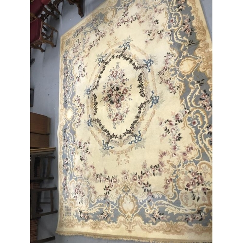8 - Carpets & Rugs: British made carpet, cream ground with floral decoration, ribbon and garland decorat... 