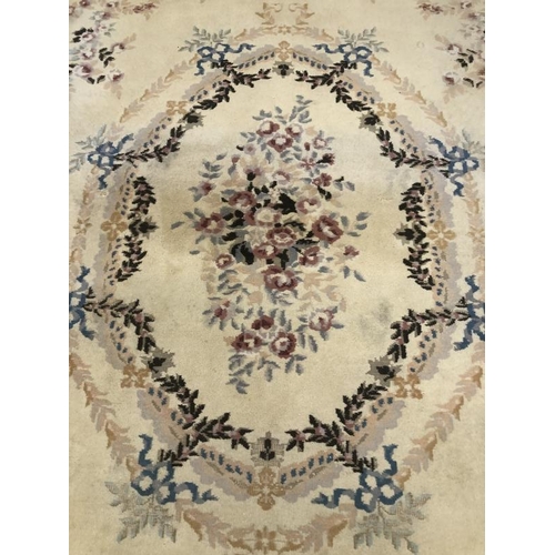 8 - Carpets & Rugs: British made carpet, cream ground with floral decoration, ribbon and garland decorat... 