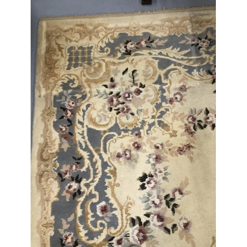 8 - Carpets & Rugs: British made carpet, cream ground with floral decoration, ribbon and garland decorat... 