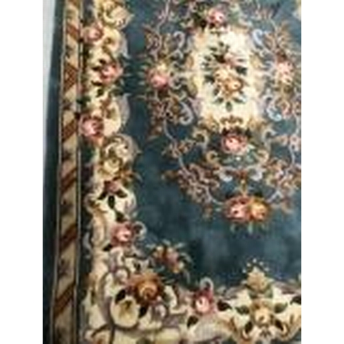10 - Carpets & Rugs: Chinese hand washed green ground with floral decoration in pinks, browns, greens and... 