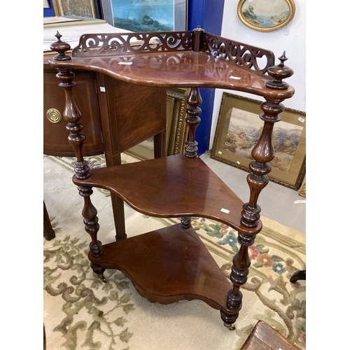100 - 19th cent. Mahogany corner three tier whatnot with pierced gallery, serpentine shaped shelves, turne... 