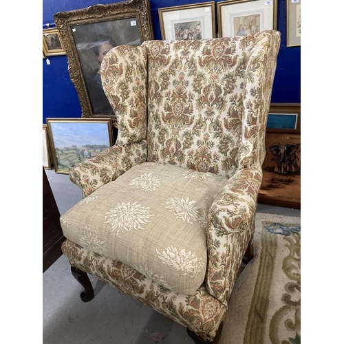 105 - 19th cent. Paisley upholstered high wing back chair, front pad feet sloping rear supports. Height 43... 