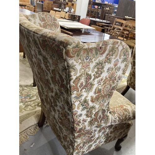 105 - 19th cent. Paisley upholstered high wing back chair, front pad feet sloping rear supports. Height 43... 