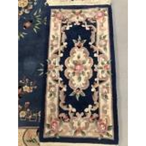 11 - 20th cent. Indian flower decorated rug. 72ins. x 48ins. Plus a larger 20th century rug.