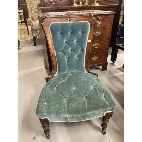 112 - Aesthetic nursing chair with carved framework, upholstered back and seat on turned legs with brass c... 