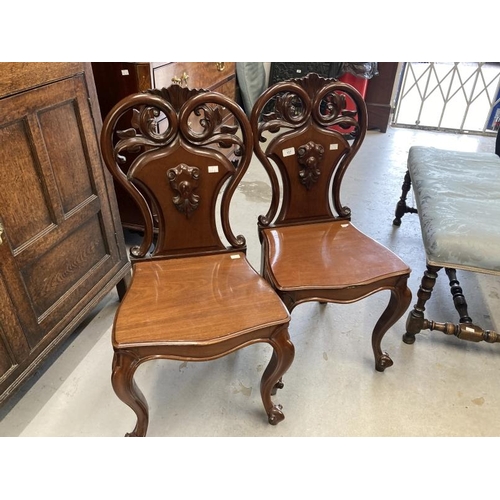 117 - 19th cent. Cuban mahogany hall chairs, cabriole legs  with pierced scroll shaped backs, a pair. 17in... 