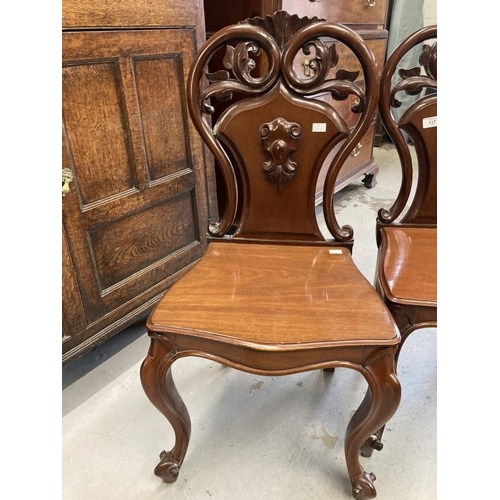 117 - 19th cent. Cuban mahogany hall chairs, cabriole legs  with pierced scroll shaped backs, a pair. 17in... 