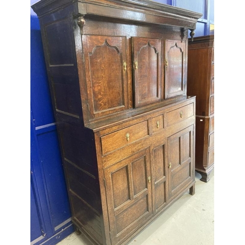 131 - 18th cent. Oak court cupboard the top has three panelled cupboard doors, the lower section with thre... 