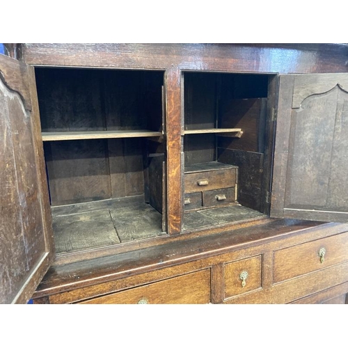 131 - 18th cent. Oak court cupboard the top has three panelled cupboard doors, the lower section with thre... 