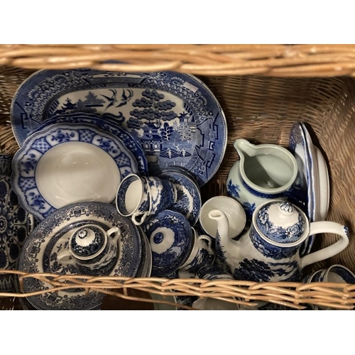 19 - Pottery: Blue and white plates etc. Includes Willow pattern meat plate, Abbey ware tea caddy, etc. I... 
