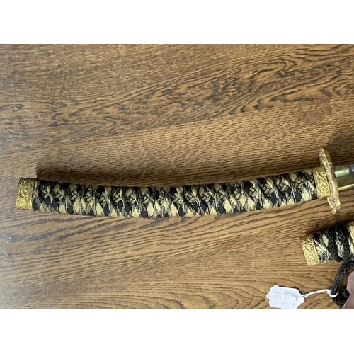 213 - Weapons: Replica Samurai sword 440 stainless steel blade in black and gilt lacquer case.