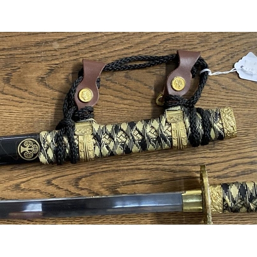 213 - Weapons: Replica Samurai sword 440 stainless steel blade in black and gilt lacquer case.