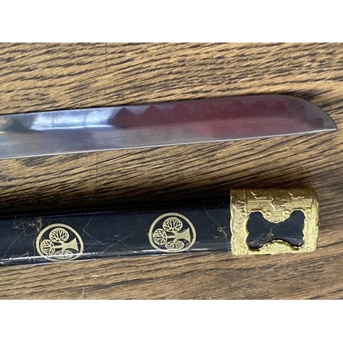 213 - Weapons: Replica Samurai sword 440 stainless steel blade in black and gilt lacquer case.