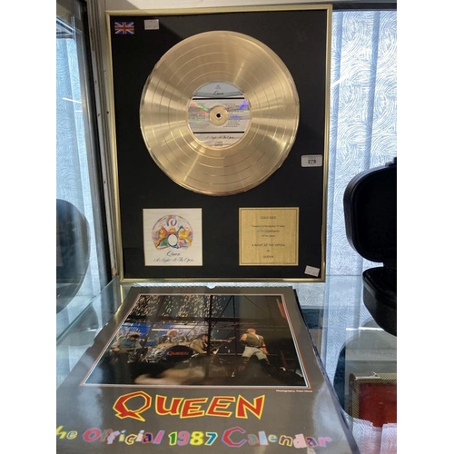 278 - Pop Memorabilia: Queen replica Gold disc and limited official calendar for 1986, '87 and '88.