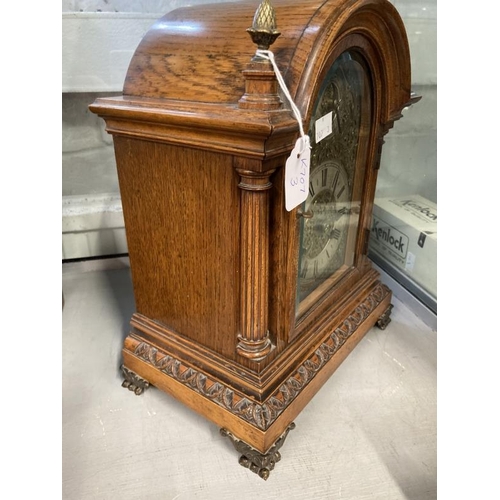 301 - Clocks & Watches: Early 20th cent. German oak cased mantel clock with gilt and white face, applied f... 