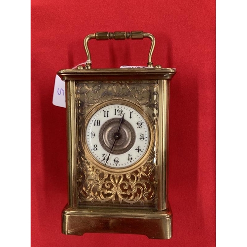 303 - Clocks & Watches: 20th cent. Brass carriage timepiece with enamel face and Roman numerals, foliate d... 