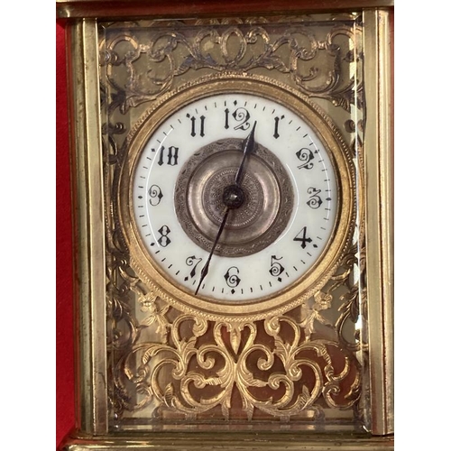 303 - Clocks & Watches: 20th cent. Brass carriage timepiece with enamel face and Roman numerals, foliate d... 