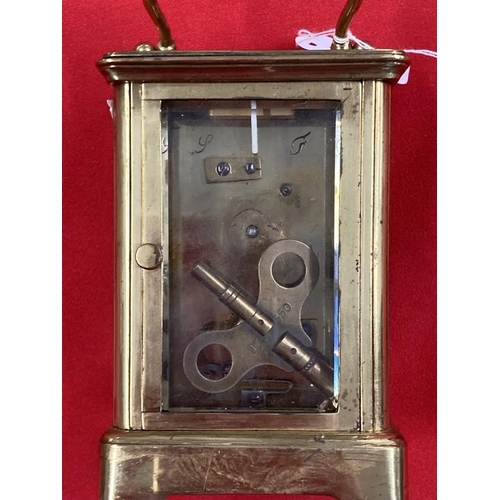 303 - Clocks & Watches: 20th cent. Brass carriage timepiece with enamel face and Roman numerals, foliate d... 