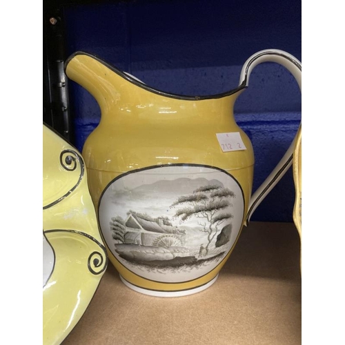 361 - Pottery: 19th cent. pearlware jug decorated en grisaille with three landscape panels on a deep yello... 