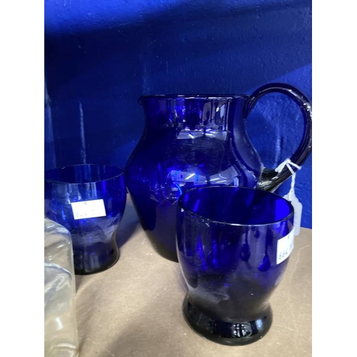 393 - Glassware: 1920s Bristol Blue glass water jug (6¾ins) and two tumblers (one replacement). Plus a sel... 