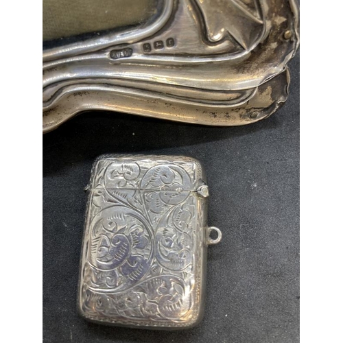 416 - Hallmarked Silver: Photograph frame with ribbon pattern border 7½ins. x 5½ins. Silver Vesta hinged t... 