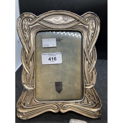 416 - Hallmarked Silver: Photograph frame with ribbon pattern border 7½ins. x 5½ins. Silver Vesta hinged t... 