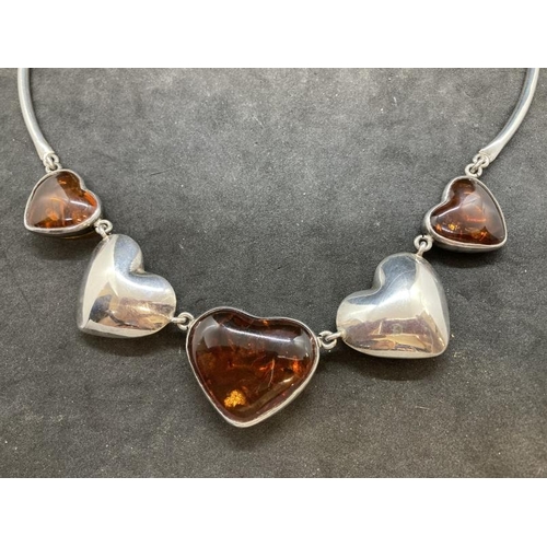 420 - Hallmarked Silver: Torque necklet at the centre are five evenly spaced graduated hearts, three set w... 