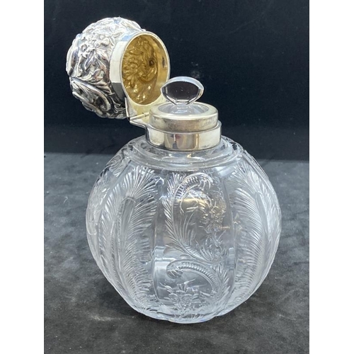 425 - Hallmarked Victorian Silver: Scent bottle in the form of a bulbous engraved glass body with scroll f... 