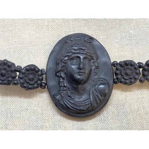 428 - 19th cent. Grand Tour cameo bracelet, black lava carved classical busts, three large 1½ins. x 1ins, ... 