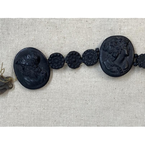 428 - 19th cent. Grand Tour cameo bracelet, black lava carved classical busts, three large 1½ins. x 1ins, ... 