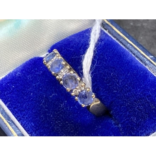 441 - Hallmarked Jewellery: 9ct gold ring half hoop set with four circular cut sapphires, estimated weight... 