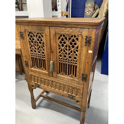 45 - 20th cent. Gothic style oak larder cupboard with two pierced and carved doors above a single fall, w... 