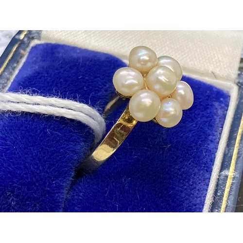 461 - Jewellery: Yellow metal ring in the form of a floral cluster of seven 4mm-3.5mm cultured pearls, tes... 