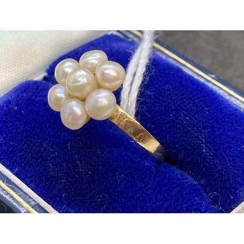 461 - Jewellery: Yellow metal ring in the form of a floral cluster of seven 4mm-3.5mm cultured pearls, tes... 