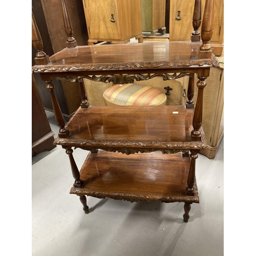 47 - Mahogany four tier whatnot with carved gallery, each shelf with carved moulded edge and pierced carv... 