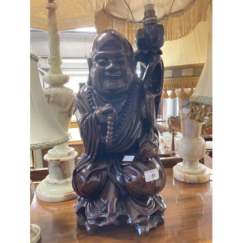 49 - Lighting: 20th cent. Chinese hardwood carved figure of a Buddha forming a lamp. Height 17½ins. Plus ... 