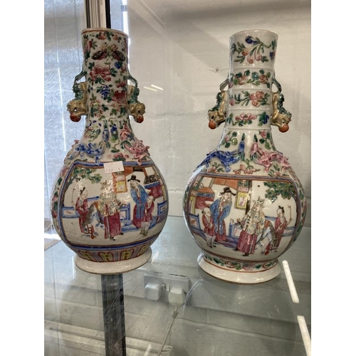 511 - 19th cent. Cantonese Famille Rose bulbous vase with narrow neck, two panels with figures, floriate d... 