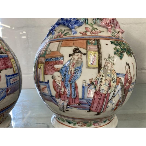 511 - 19th cent. Cantonese Famille Rose bulbous vase with narrow neck, two panels with figures, floriate d... 