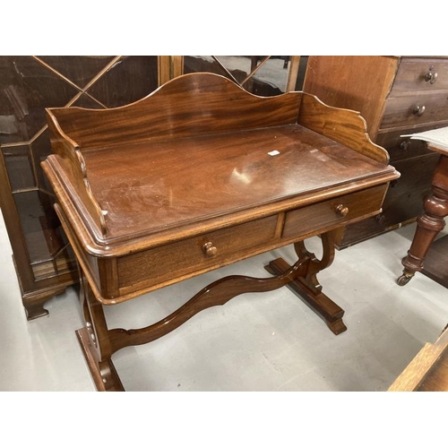 63 - 19th cent. Mahogany two drawer dressing table with raised gallery on vase shaped supports joined wit... 