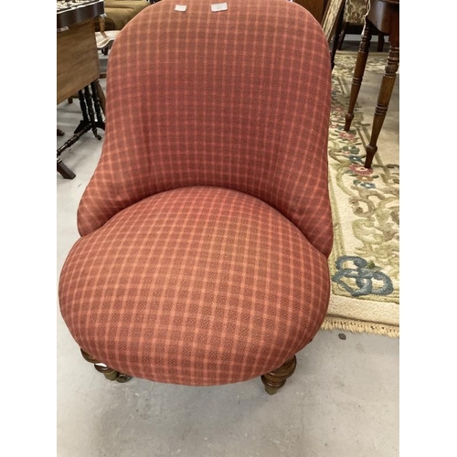 67 - Victorian upholstered nursing chair on turned legs to the front with castors. 31ins. x 25ins.