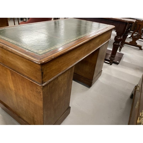 77 - 19th cent. Mahogany pedestal desk the rectangular top with green and gold tooled leather surface abo... 