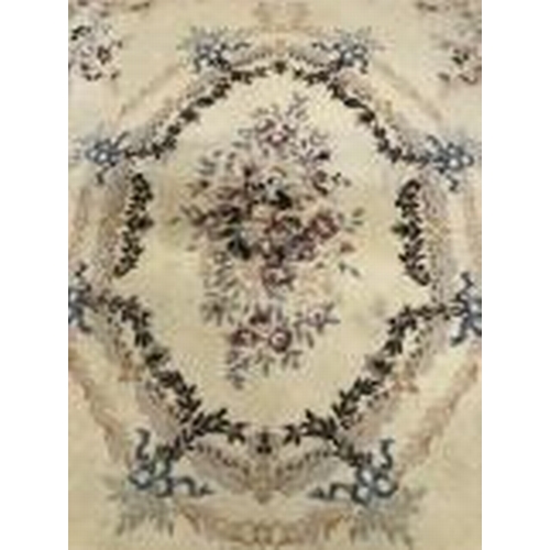 8 - Carpets & Rugs: British made carpet, cream ground with floral decoration, ribbon and garland decorat... 