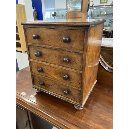 84 - 19th cent. Apprentice mahogany dwarf chest of four drawers. 15ins. x 19ins. x 12ins.