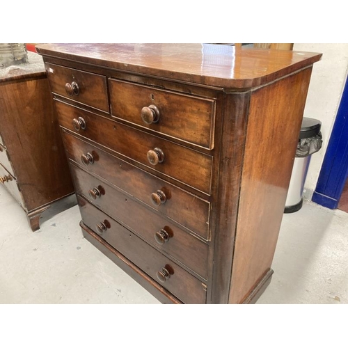 88 - 19th cent. Mahogany chest of two over four long drawers, turned knob handles on a plinth base. 47ins... 