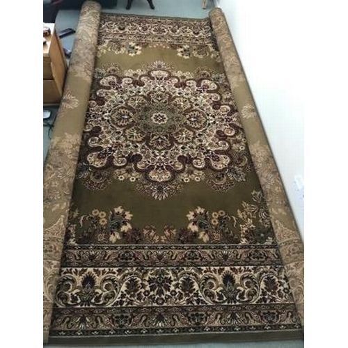9 - Rugs: Super Keshan green ground rug. Approx. 118ins. x 173ins.