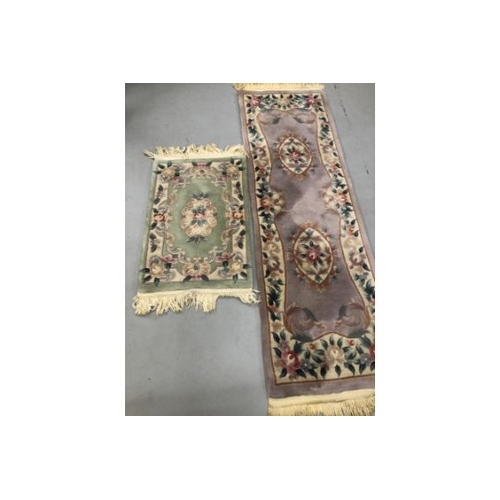 7 - Carpets & Rugs: Chinese hand washed runner, mauve ground, floral decoration in reds, blues, greens a... 