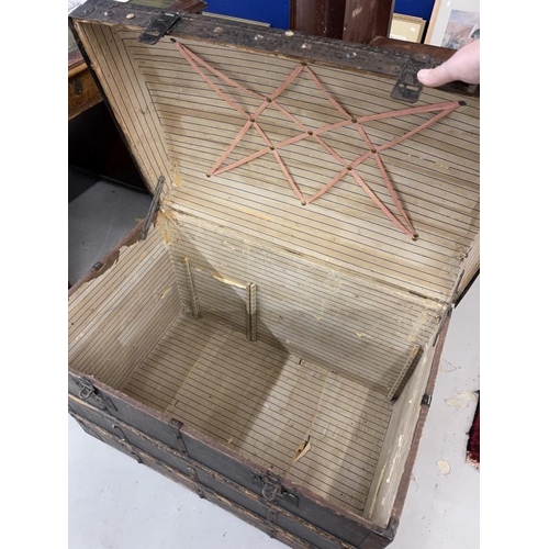 108 - 19th cent. Domed top travelling trunk with metalwork strapping.