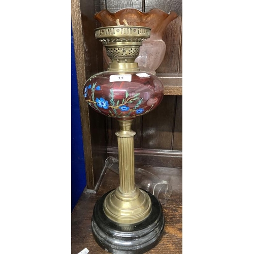 14 - Victorian oil lamp black ceramic base, reeded brass column, cranberry glass reservoir with enamelled... 