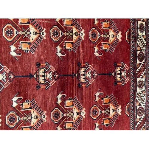 20 - Carpets & Rugs: Late 19th/early 20th cent. Persian carpet, red ground with a central panel containin... 