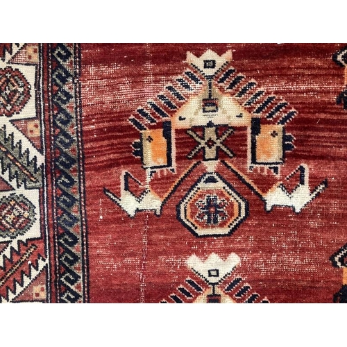 20 - Carpets & Rugs: Late 19th/early 20th cent. Persian carpet, red ground with a central panel containin... 